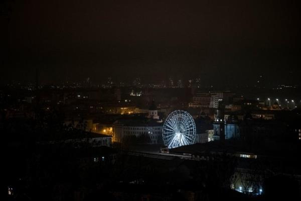 A ferris wheel is lit as sporadic power cuts leave parts of the city in darkness on Nov. 5, 2022 in Kyiv. (Ed Ram/Getty Images)