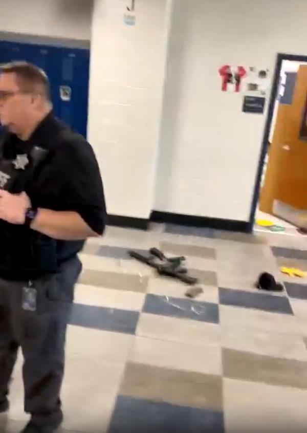 Screenshot of a video taken inside Apalachee High School on the day of the shooting shows a rifle on the floor
