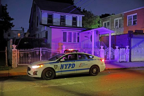 Police officers at a crime scene on 164 Street and 108 Avenue, responding to a verbal dispute turned deadly assault.